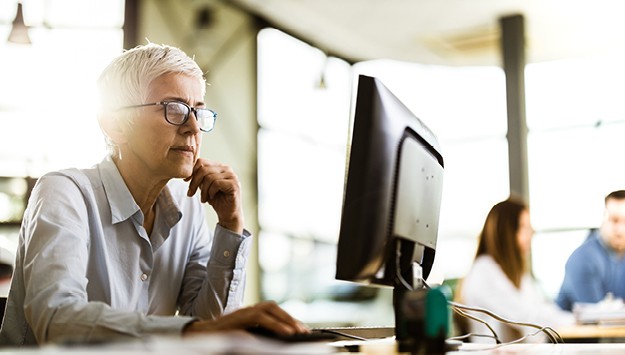 woman analyzing AML compliance program
